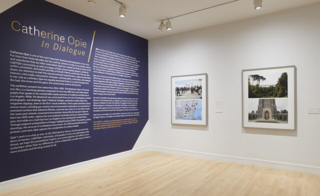 Picture of Catherine Opie exhibition. Two photographs and description of Catherine Opie.