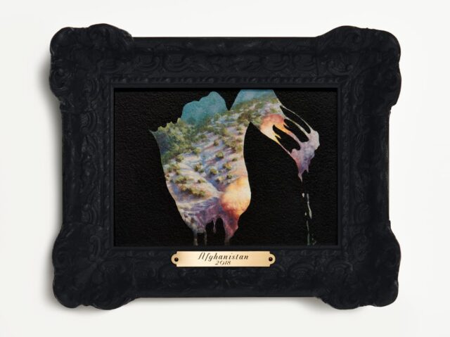 Small black frame with a brush of paint that reveals a landscape underneath, labeled with a gold bar that says 